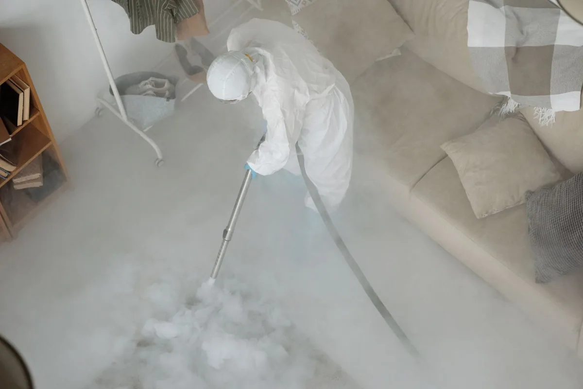 Biohazard cleanup technician in protective equipment, Whitehall, MI